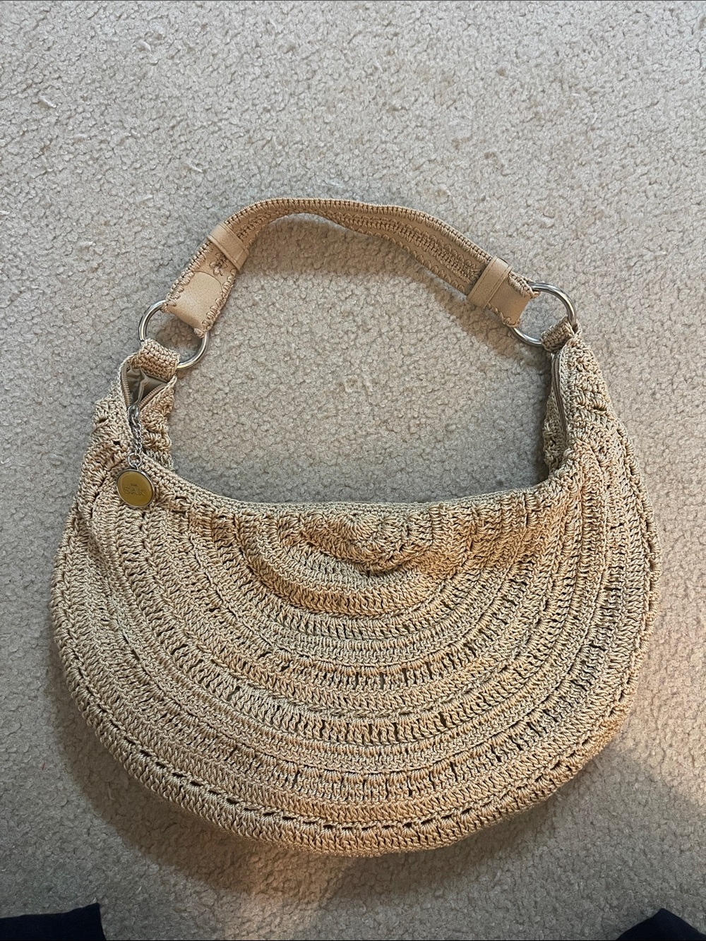 The Sak Woven Crescent Shoulder Bag in Natural Beige